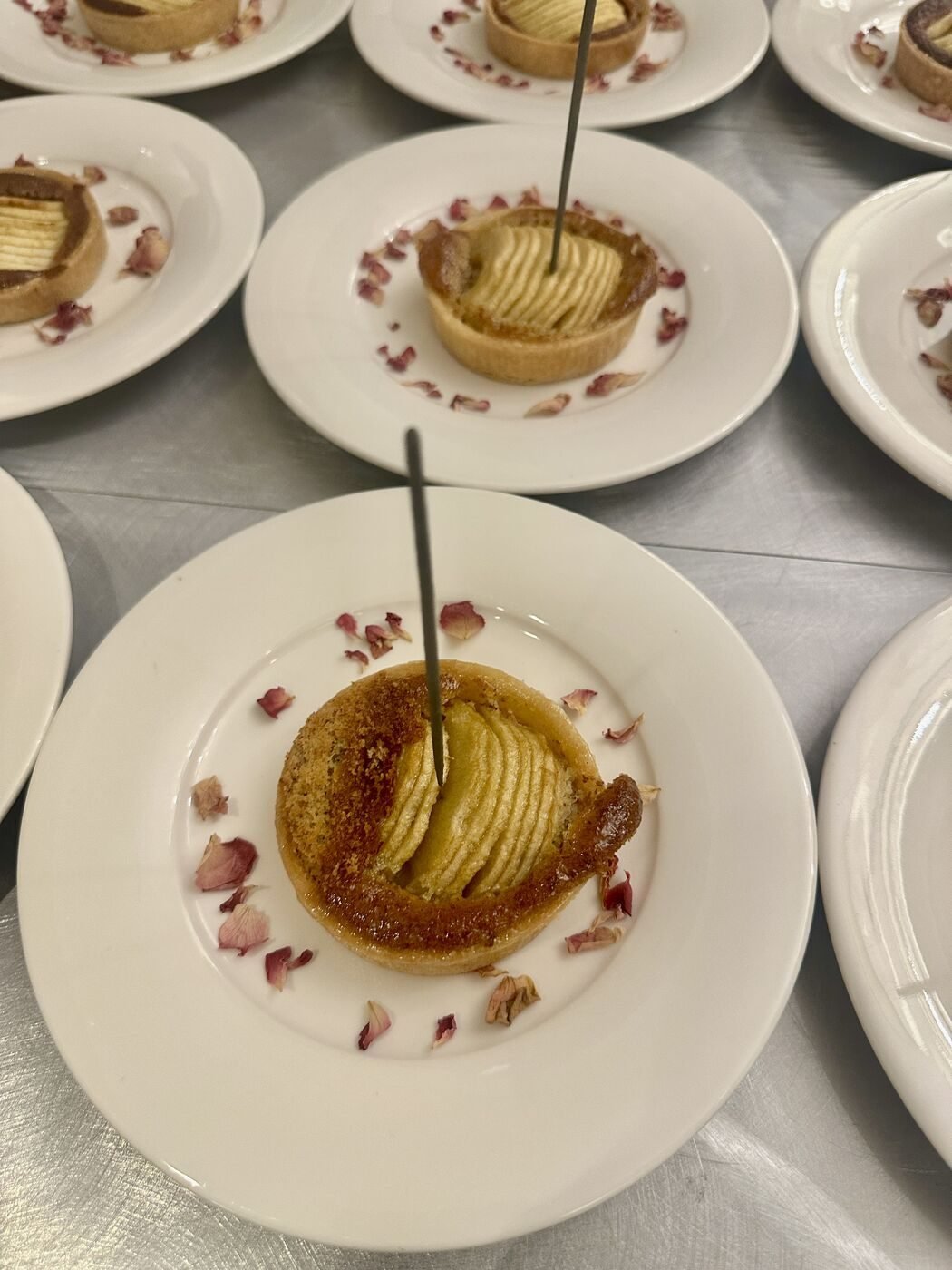 Individual apple tart with rose petals