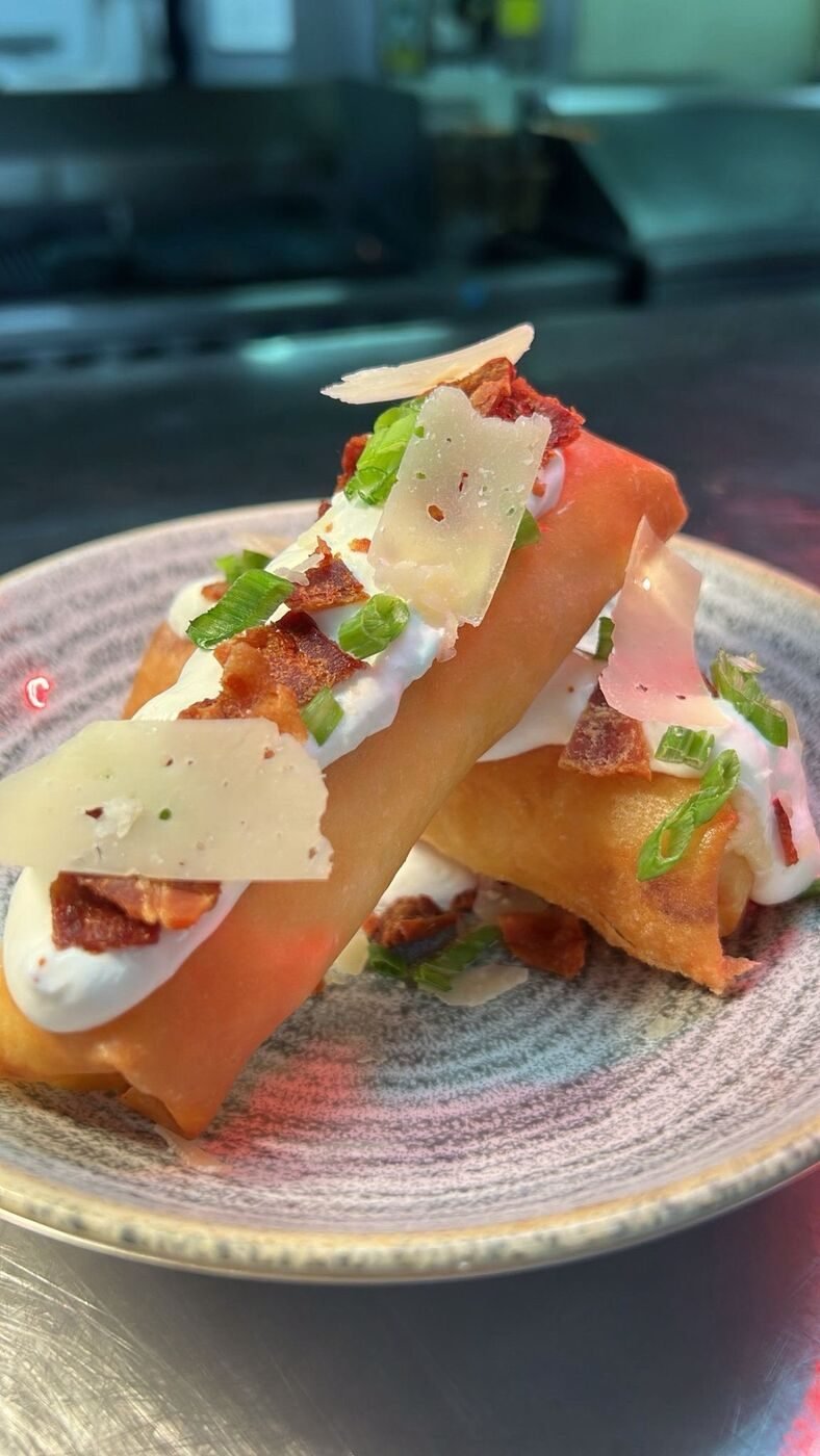 Crispy roll with whipped cream, bacon, and shaved parmesan