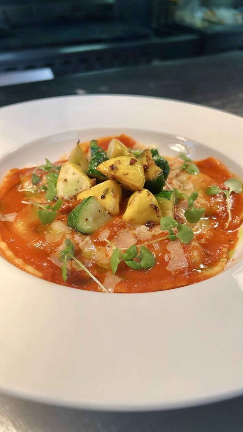 Ravioli with tomato sauce and roasted vegetables